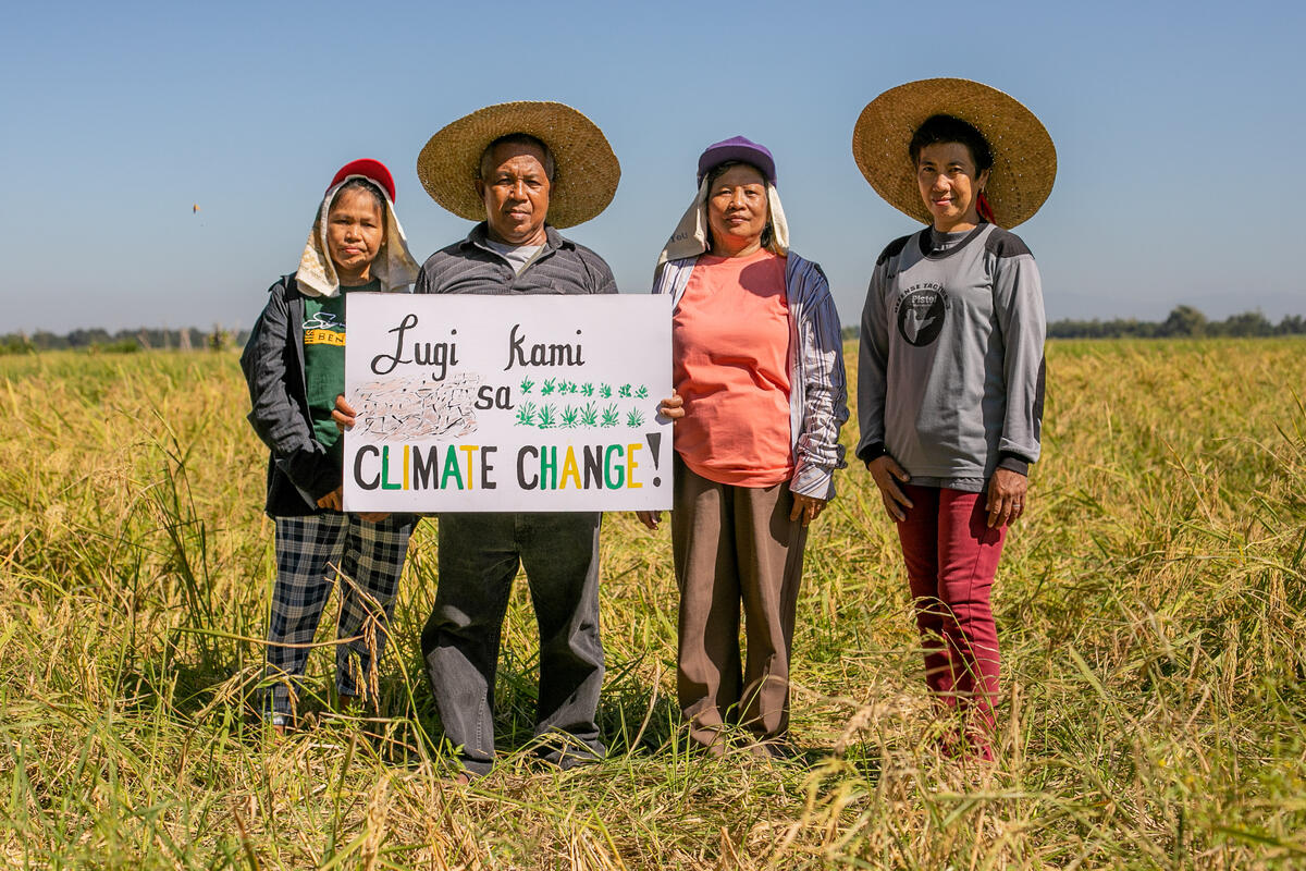 In the wake of Super Typhoon Karding, farmers in Tarlac protested in a storm-damaged farm, holding placards saying "We are suffering losses because of climate change," calling for Loss and Damage finance a month ahead of COP27, the UN climate talks.© Basilio Sepe / Greenpeace