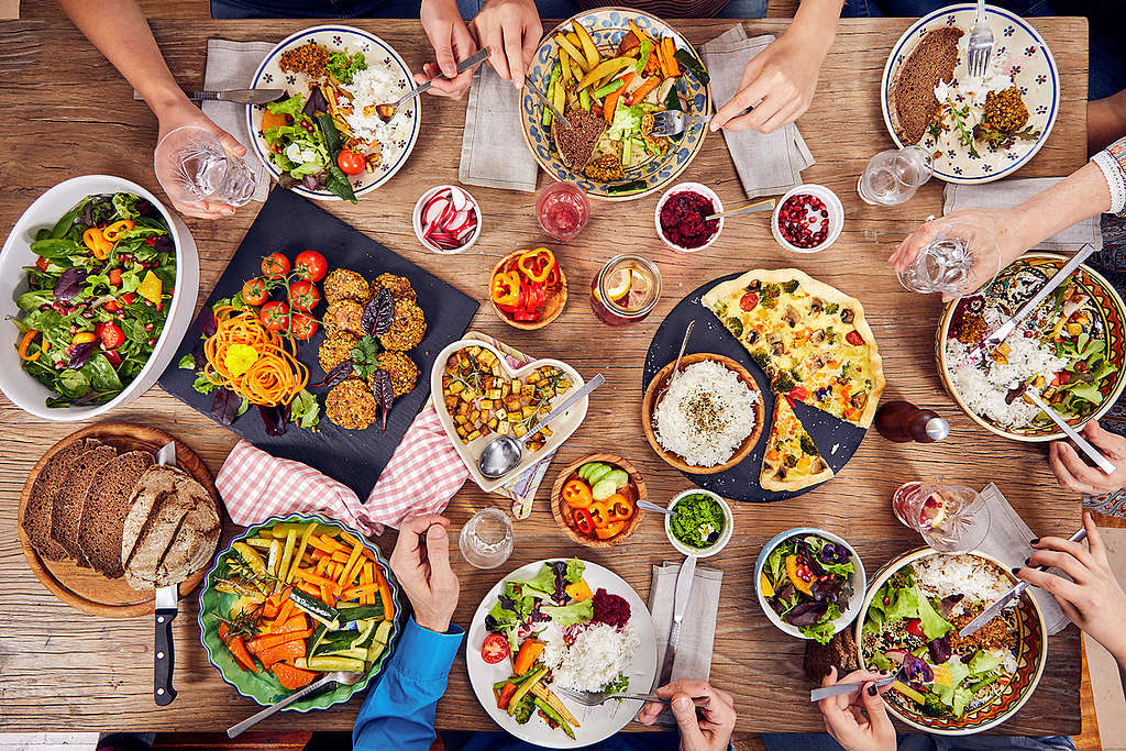 Family Eating Vegetarian Food at Home in Vienna. © Mitja Kobal / Greenpeace