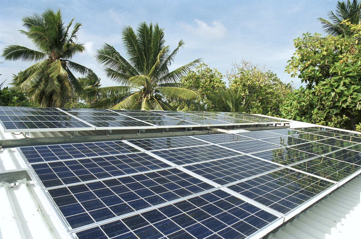 Solar panels on refrigeration plant (for keeping fish fresh). Likiep Atoll, Marshall Islands. © Greenpeace / Steve Morgan