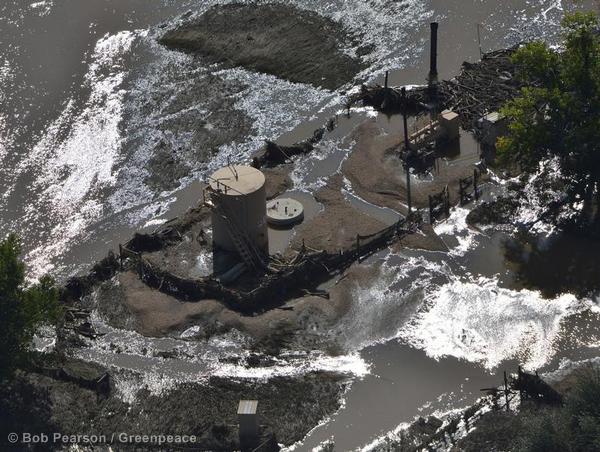 Flood waters recede from an oil operation by the South Platte River near Greeley 