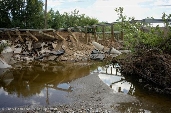 Portions of a bridge remain standing after flood waters from the St. Vrain River washed through Longmont. 