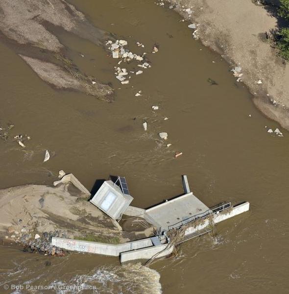 Debris lies in the riverbed of the South Platte River