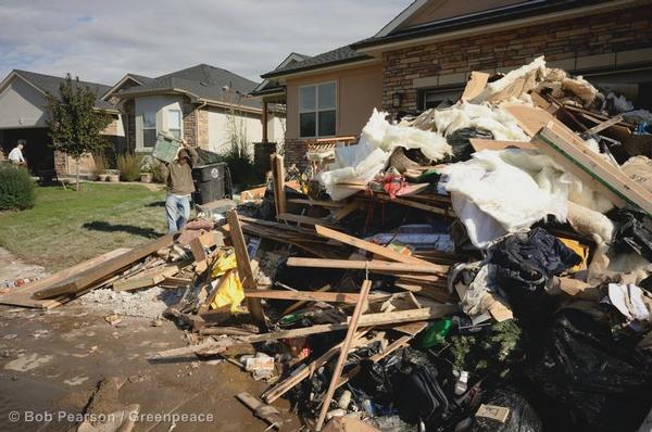 Residents clear their houses of debris