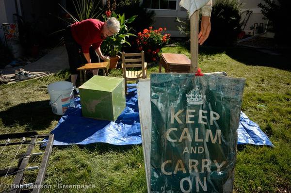 Jan Alford cleans some furniture from her flooded home