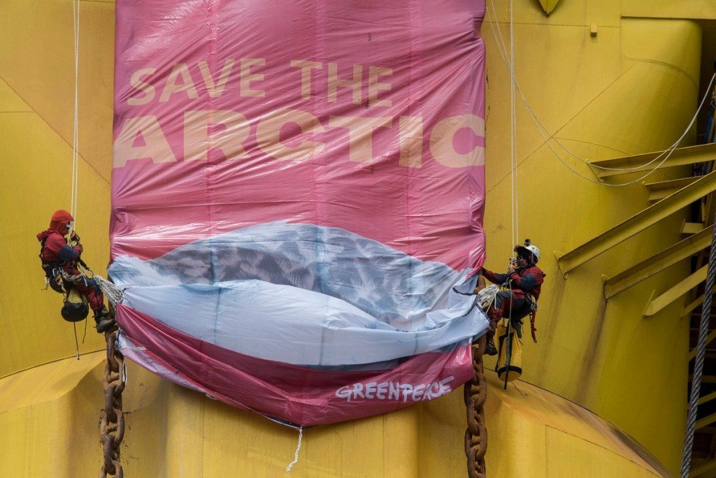 Greenpeace activists have rigged a 'Save the Arctic' banner showing an Arctic Owl and containing the signatures of millions of supporters on a leg of the Polar Pioneer oil rig in the Pacific Ocean. Six Greenpeace climbers have intercepted an Arctic-bound Shell oil rig in the middle of the Pacific Ocean, 750 miles north-west of Hawaii and have scaled the 38,000 tonne platform. The six, from the USA, Germany, New Zealand, Australia, Sweden and Austria, sped towards the Polar Pioneer, which Shell intends to use to drill for oil in the Chukchi Sea, in inflatable boats launched from the Greenpeace ship Esperanza.