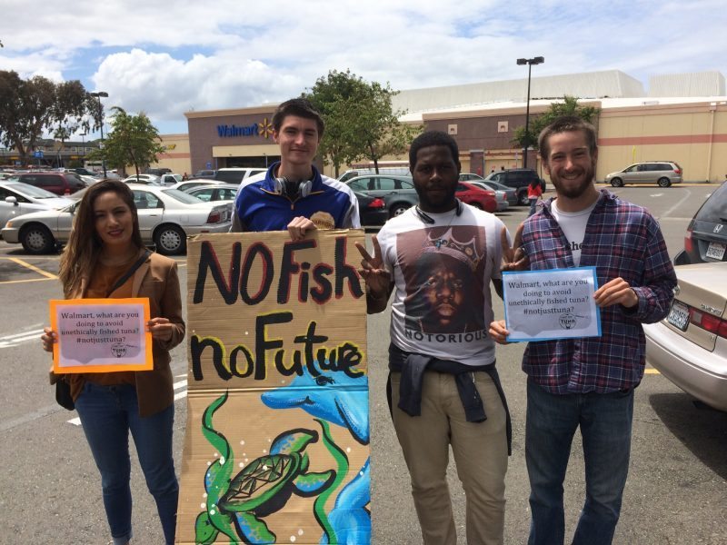 Volunteers demand Walmart stop destroying the ocean for cheap tuna.
