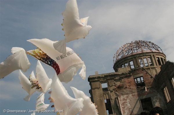 Peace doves fly on the eve of the 60th Anniversary of the Hiroshima Atomic Bombing in 2005. The message of peace reads: "No More Hiroshima"