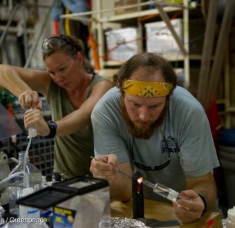 Independent scientific researchers Sally Walker, left and Clifton Nunnally, both , work in their make-shift laboratory analyizing water samples collected by the CTD unit (conductivity, temperature and depth) aboard the Greenpeace ship, MY Arctic Sunrise, in the Gulf of Mexico.