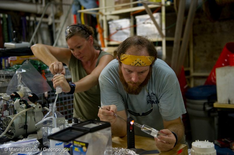 Independent scientific researchers Sally Walker, left and Clifton Nunnally, both , work in their make-shift laboratory analyizing water samples collected by the CTD unit (conductivity, temperature and depth) aboard the Greenpeace ship, MY Arctic Sunrise, in the Gulf of Mexico.