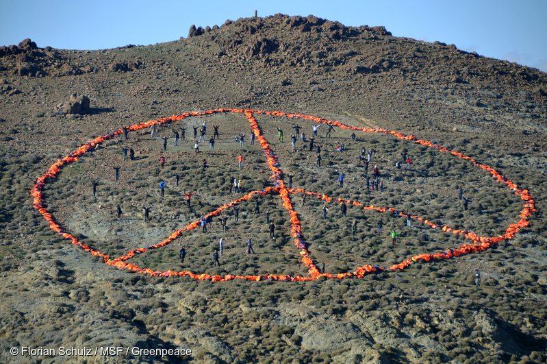 On New Years Day 2016, a Médecins Sans Frontières/Doctors without Borders (MSF)-Greenpeace team on the Greek island of Lesbos were joined by groups such as Sea-Watch, the Dutch Refugee Boat Foundation and local communities, to create a peace sign formed from over 3,000 discarded refugee life jackets. The groups are called for safe passage to those fleeing war, poverty and oppression.