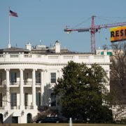 Greenpeace activists deploy a banner on a construction crane near the White House reading "RESIST" on President Trump's fifth day in office. The activists were calling for those who want to resist Trump's attacks on environmental, social, economic and educational justice to contribute to a better America.